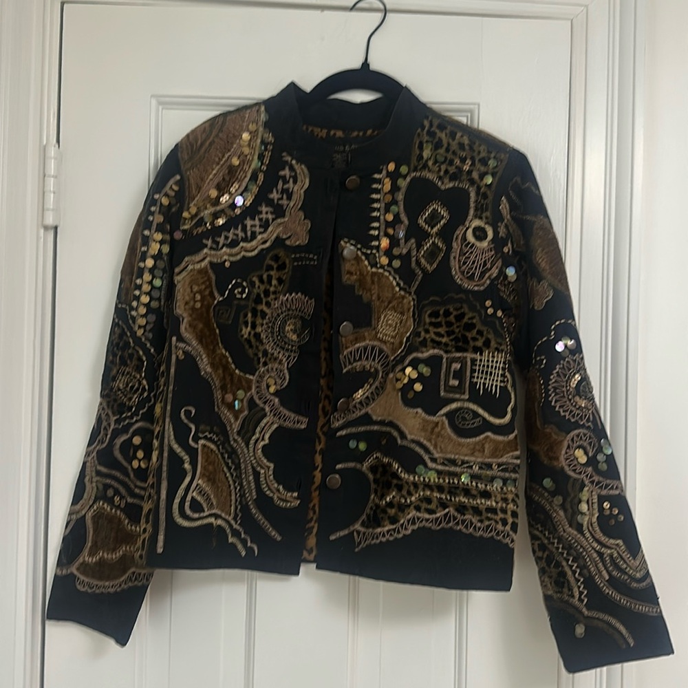 Black & brown jacket with leopard lining.